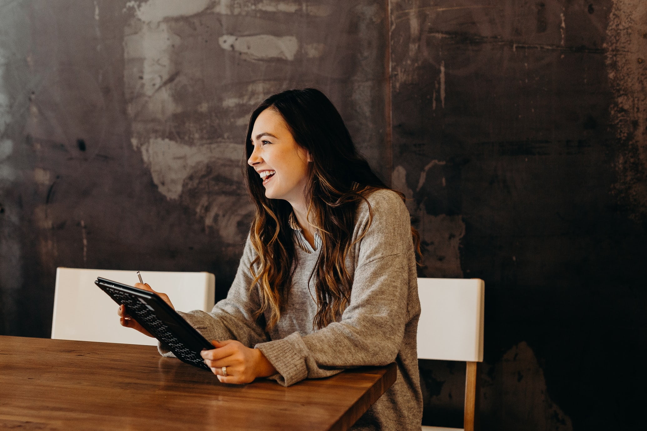 Women smiling with a tablet