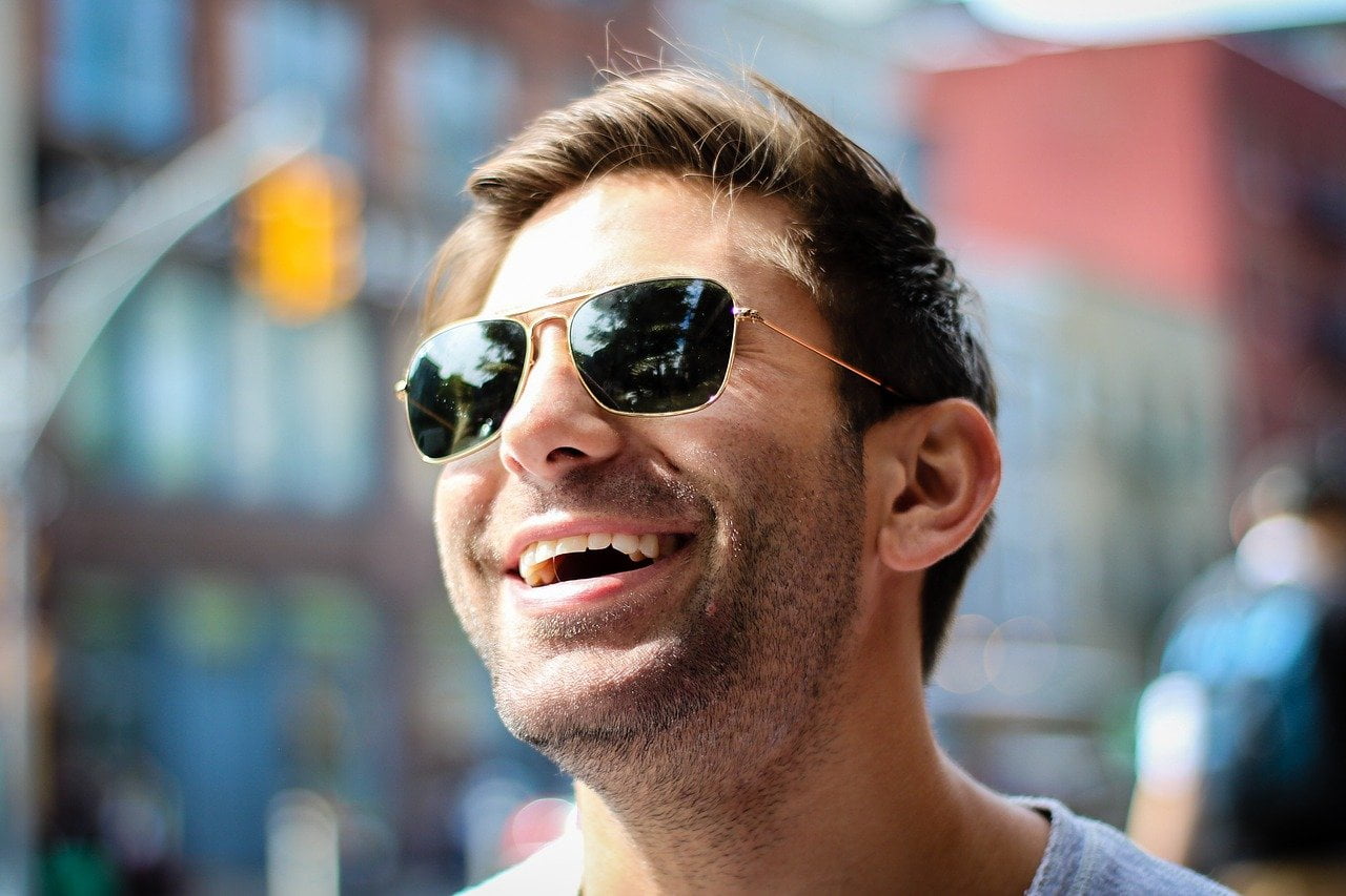 Laughing man with sunglasses
