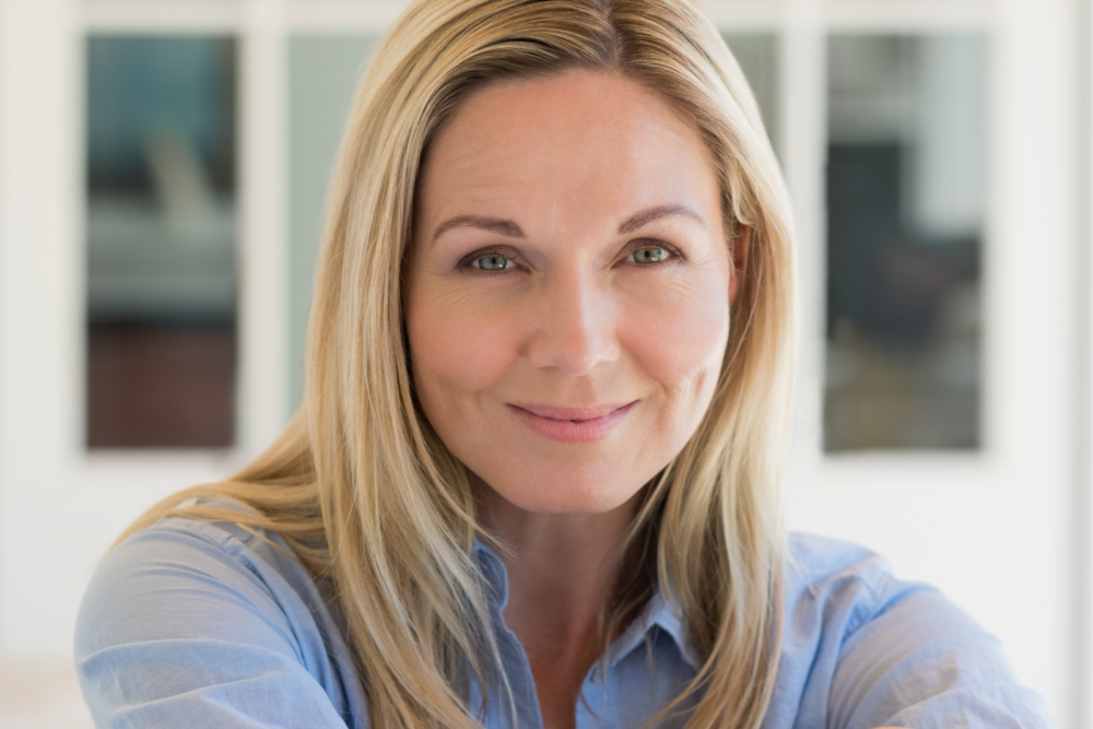 Blonde woman smiling at the camera